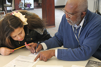 Photo of Cranbrook Horizons Upward-Bound faculty tutoring. Link to Life Stage Gift Planner Over Age 65 Situations.